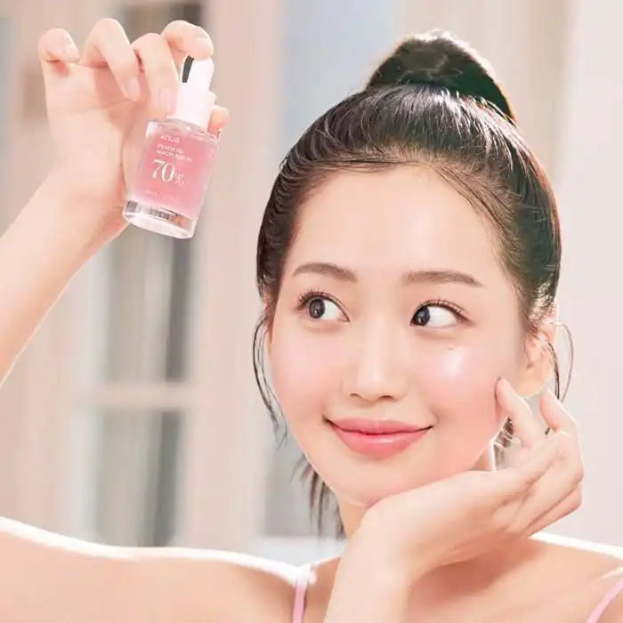 ANUA Peach 70 Niacin Serum in a 30ml bottle, featuring a sleek design with the product label visible.