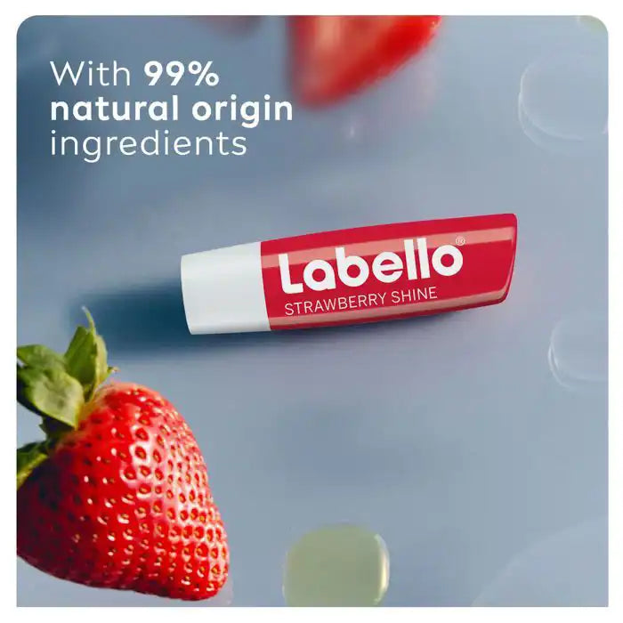 Labello Fruity Shine Fraise lip balm by Celvess Cosmetic, hydrating with SPF 10, 4.8g, showing the pink lip balm in a tube