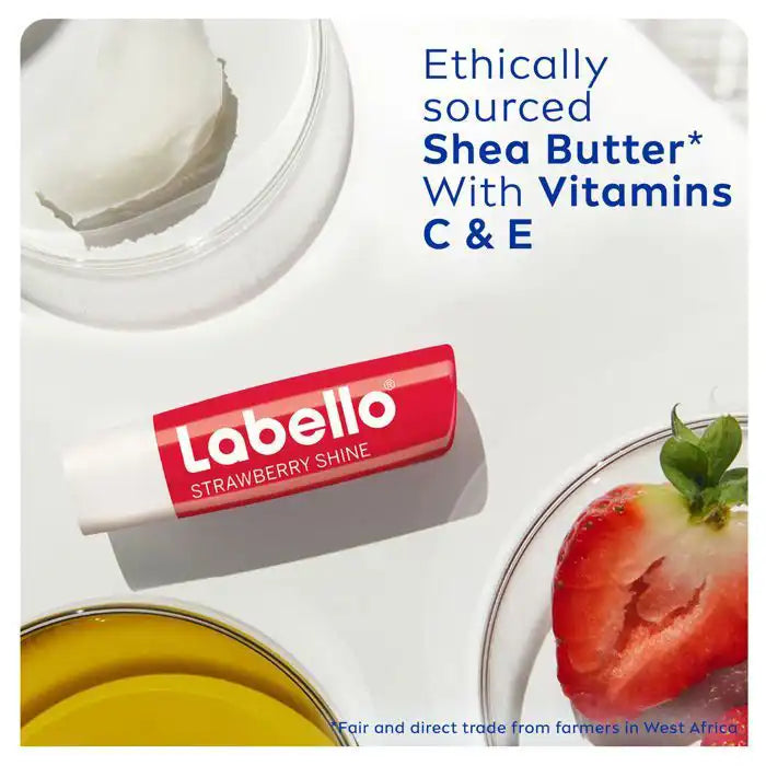 Labello Fruity Shine Fraise moisturizing lip balm with SPF 10 in a 4.8g tube, featuring a fruity strawberry flavor.