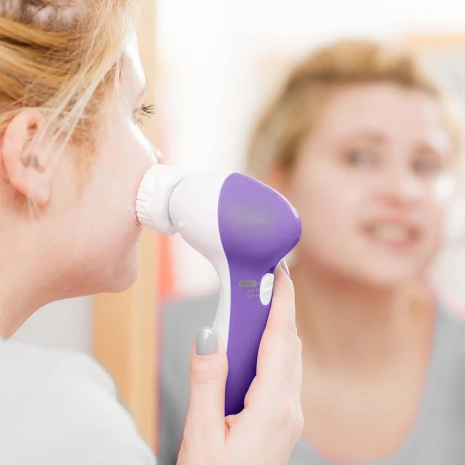 Electric 5-in-1 facial cleansing brush by Celvess Cosmetic with multiple brush heads for deep skin cleansing.