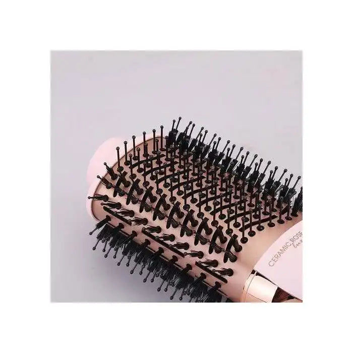 Celvess Cosmetic Enzo electric rotative blow-drying brush for quick styling, shown in use with hair being dried and styled.