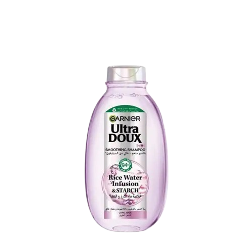 Garnier Ultra Doux rice water shampoo bottle, 400ml, with a clean label and white cap, showcasing nourishing hair care.