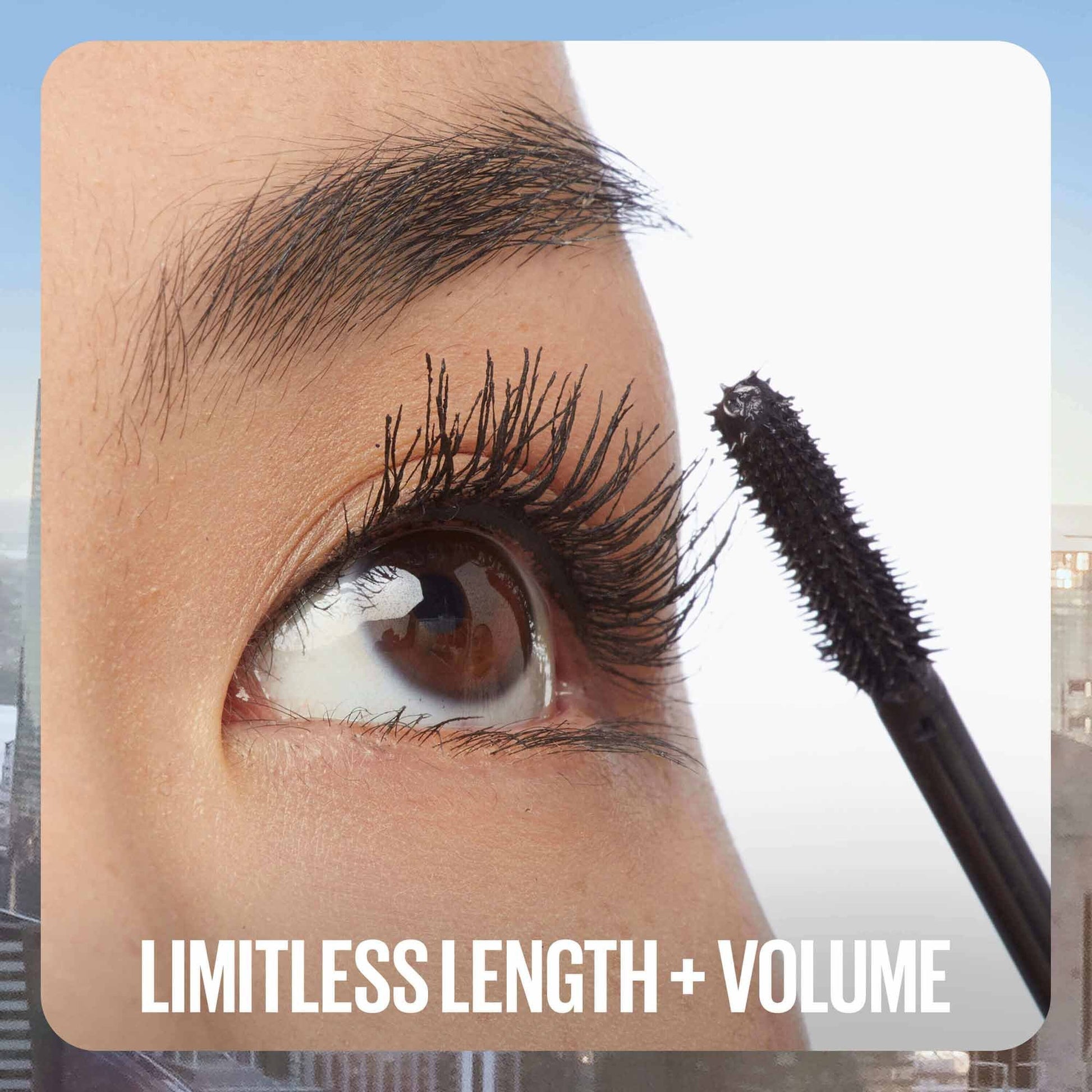 Maybelline Sky High mascara tube with bristle brush, showcasing long, voluminous lashes for a bold eye look.