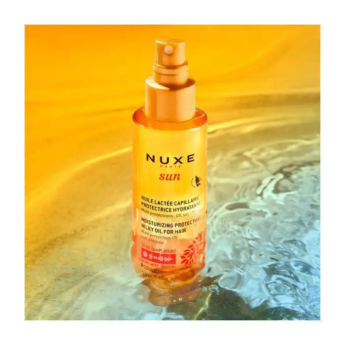 Nuxe Sun Huile Lactée Capillaire Protectrice Hydratante in 100ml bottle, nourishing hair oil with protective and hydrating properties.