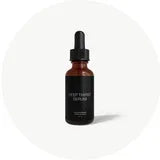 Bouteille compte-gouttes de soin visage, flacon ambré sur fond blanc, cosmétique